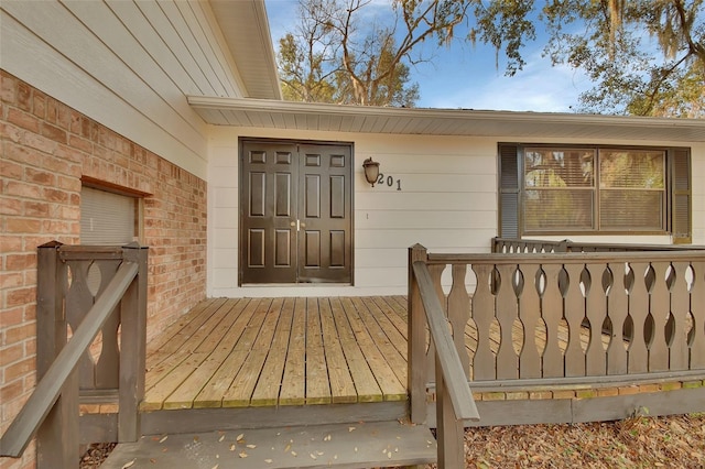 entrance to property with a deck