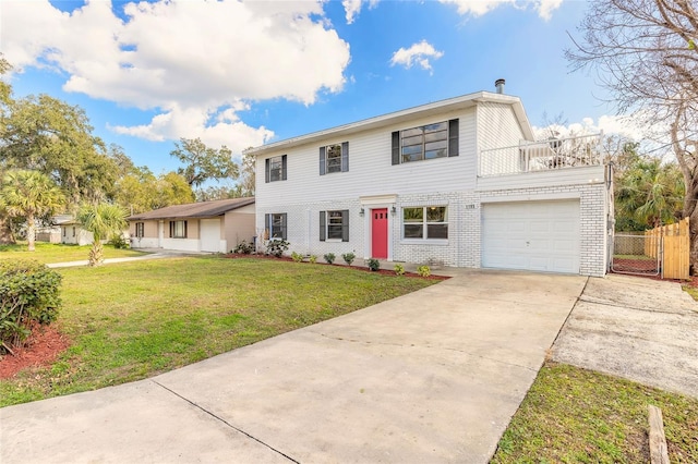 view of front of home with concrete driveway, an attached garage, fence, a front yard, and brick siding