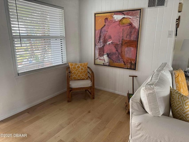 sitting room with light hardwood / wood-style floors