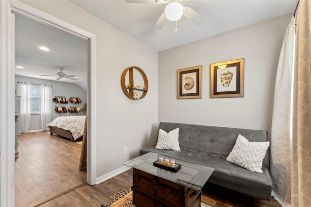 living room with ceiling fan and hardwood / wood-style floors