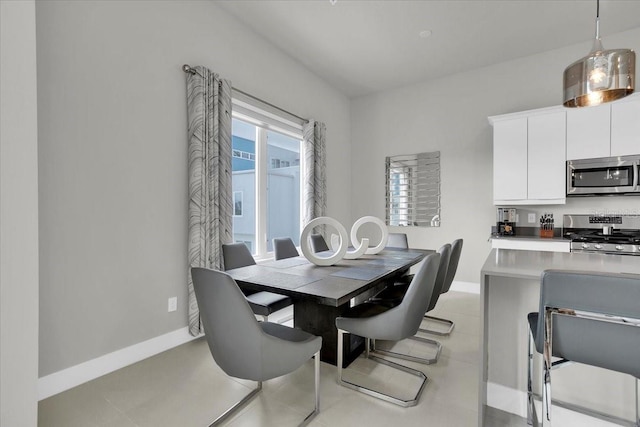 dining area with light tile patterned floors