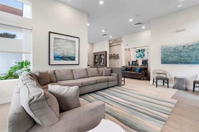 living room featuring a high ceiling