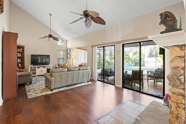 living room with ceiling fan, wood-type flooring, and high vaulted ceiling