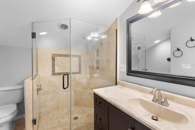 bathroom with vanity, an enclosed shower, and toilet