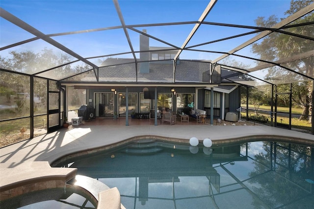 view of swimming pool featuring grilling area, a patio, and glass enclosure