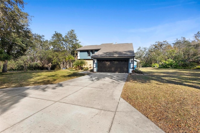 view of front of property featuring a garage and a front yard