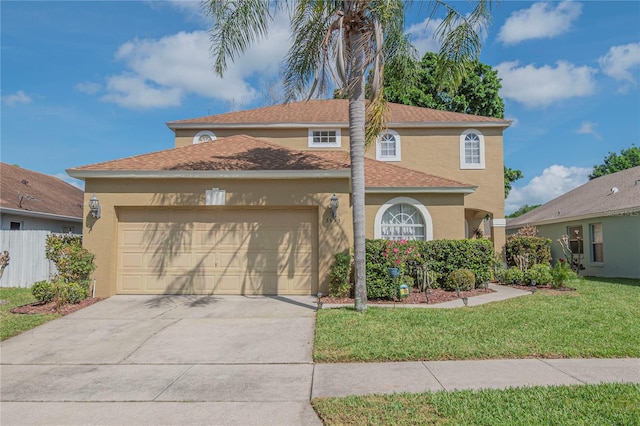 view of front of property featuring a garage and a front lawn