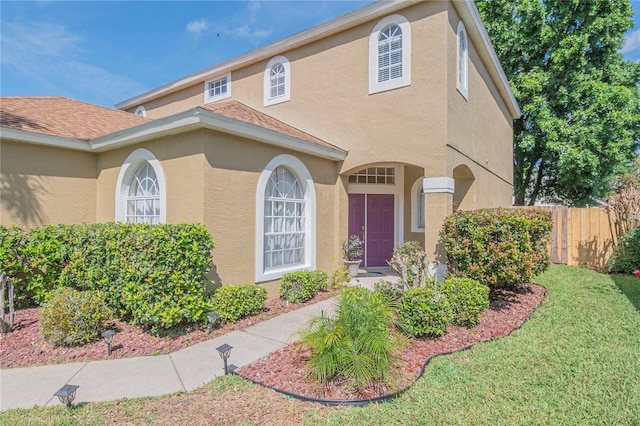 view of front of home with a front lawn