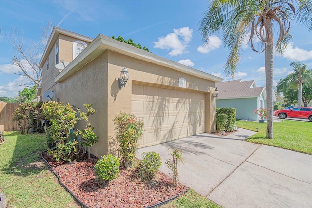 view of home's exterior with a garage and a yard