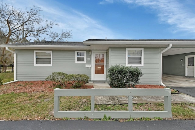 view of front of property with a carport