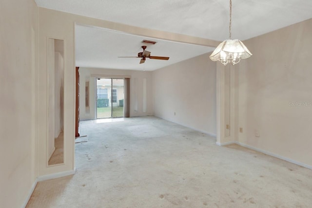 carpeted spare room featuring ceiling fan