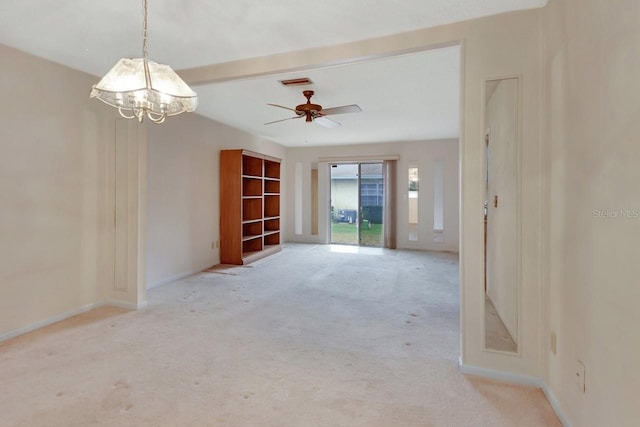 unfurnished room featuring beamed ceiling and light colored carpet