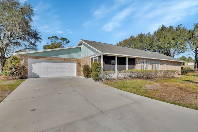 ranch-style house with a garage and a front yard