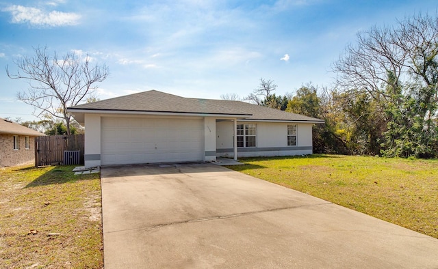 ranch-style home featuring a garage, a front yard, and central air condition unit