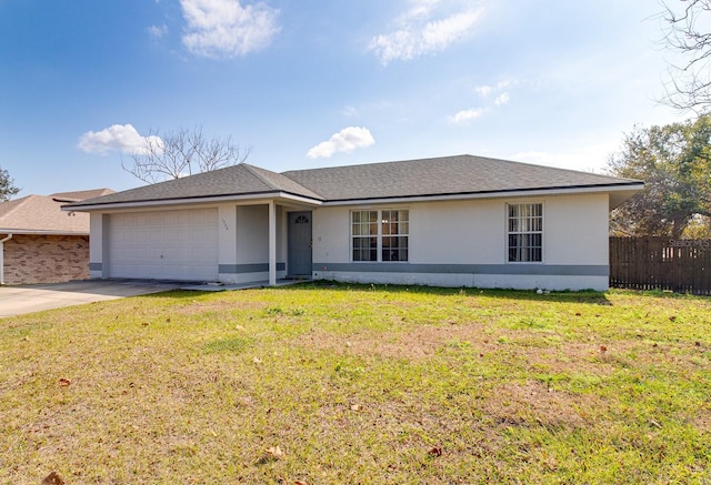 single story home featuring a garage and a front lawn