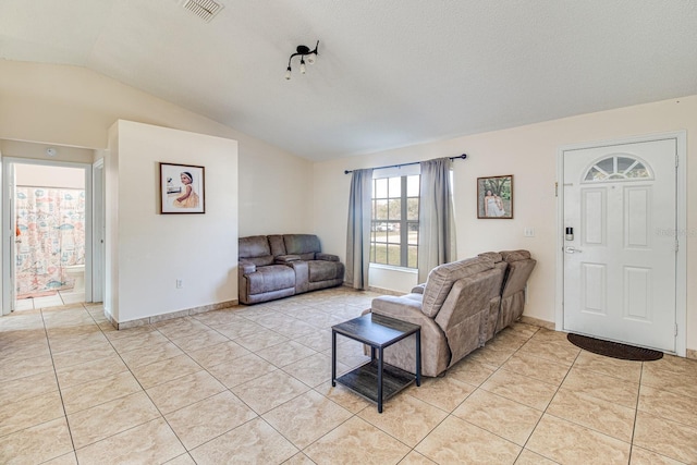 tiled living room with vaulted ceiling