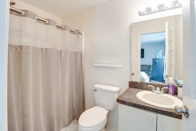 bathroom featuring walk in shower, vanity, and toilet