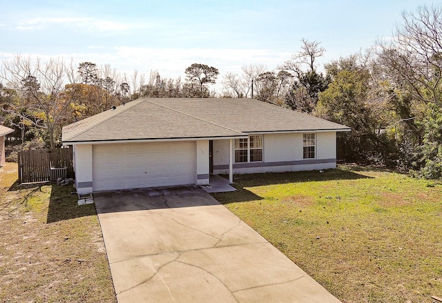 view of front facade with a garage and a front lawn