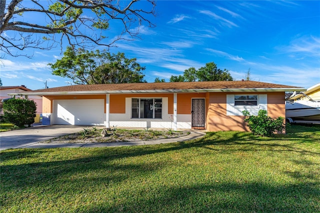 single story home with a garage and a front yard