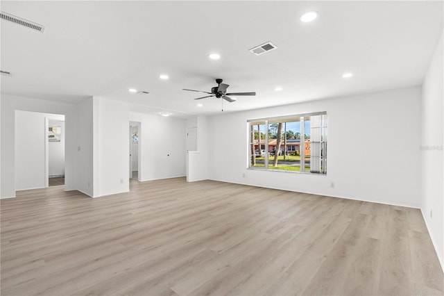 unfurnished living room featuring light hardwood / wood-style floors and ceiling fan