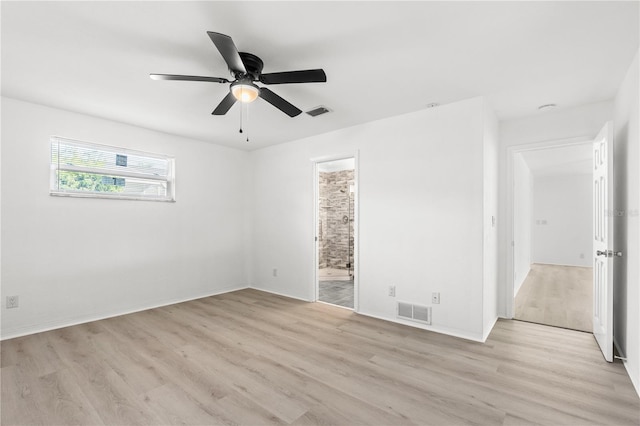 spare room featuring ceiling fan and light wood-type flooring