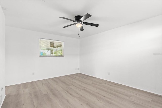 unfurnished room featuring ceiling fan and light wood-type flooring