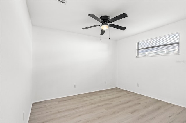 spare room featuring ceiling fan and light hardwood / wood-style flooring