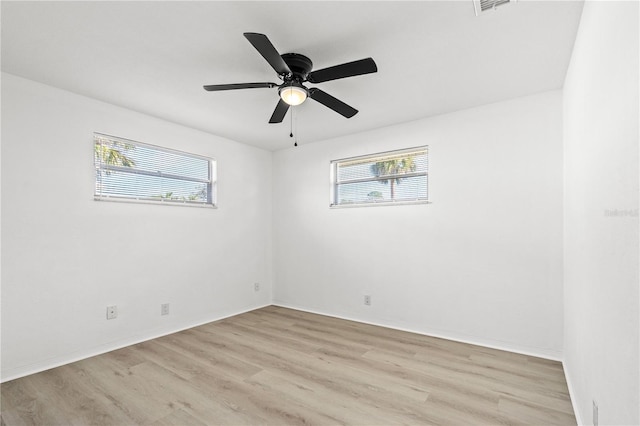 unfurnished room featuring ceiling fan, plenty of natural light, and light hardwood / wood-style floors