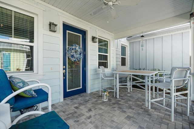 view of patio / terrace with ceiling fan and a porch