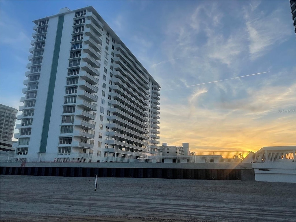 view of outdoor building at dusk