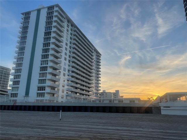 view of outdoor building at dusk