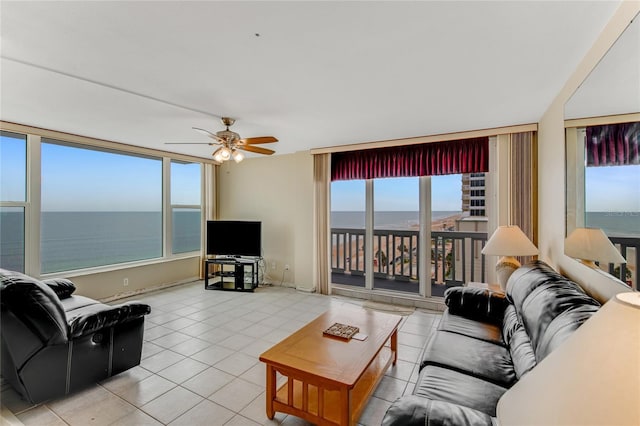 living room with light tile patterned flooring and ceiling fan