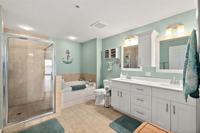 full bathroom featuring tile patterned flooring, vanity, a textured ceiling, independent shower and bath, and toilet