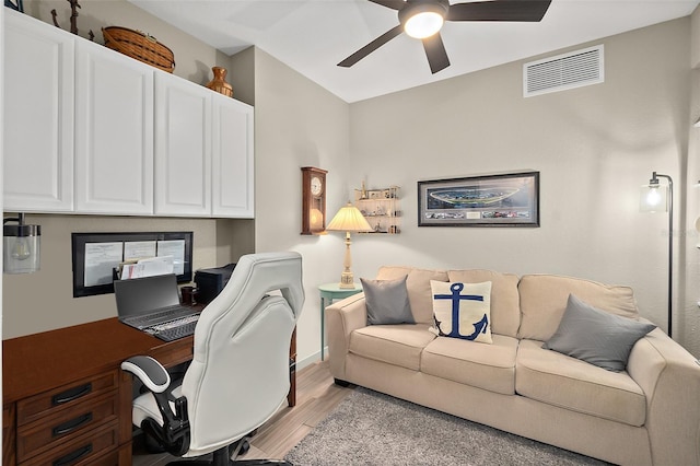 office with ceiling fan and light hardwood / wood-style floors