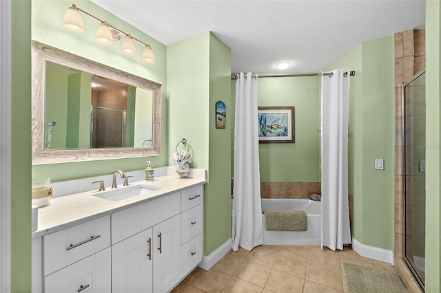 bathroom with independent shower and bath, vanity, tile patterned floors, and a textured ceiling