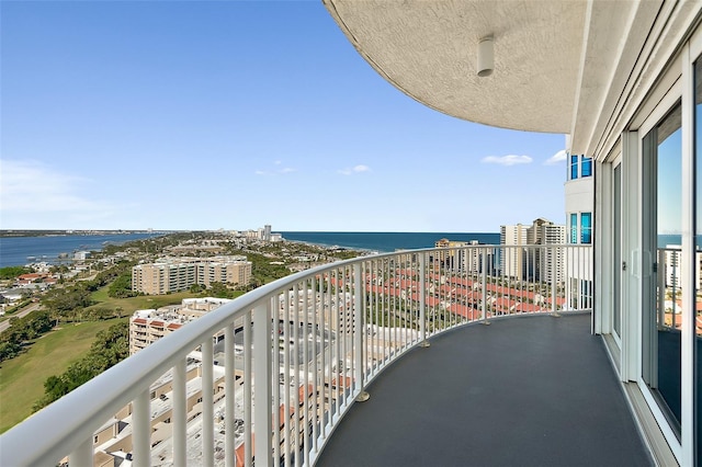 balcony featuring a water view