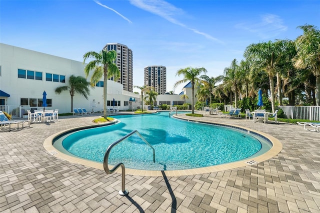 view of swimming pool with a patio area