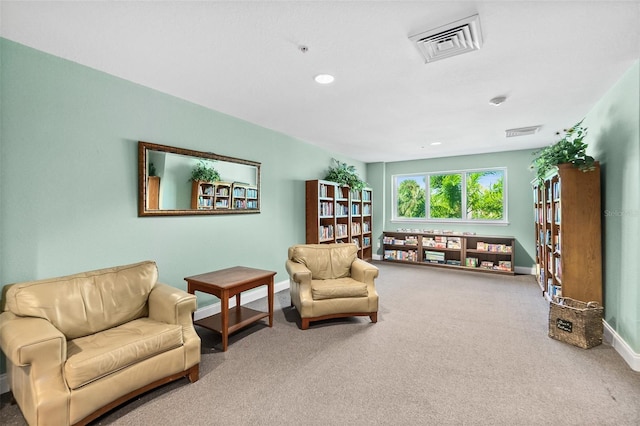 living area featuring carpet floors