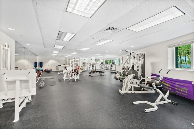 exercise room featuring a paneled ceiling