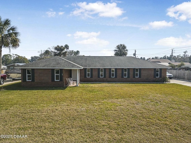 single story home featuring a front yard