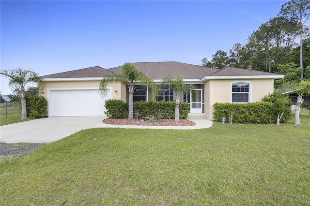 ranch-style home featuring a garage and a front yard