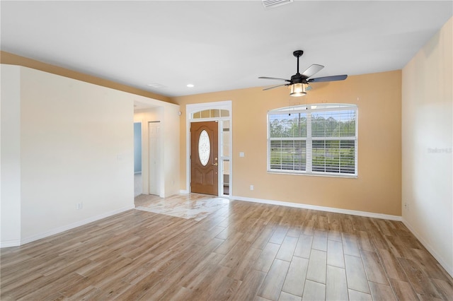 entryway featuring ceiling fan and light wood-type flooring