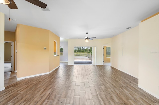 unfurnished living room with ceiling fan and light hardwood / wood-style flooring