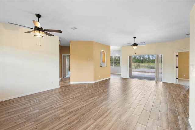 unfurnished living room with ceiling fan and light wood-type flooring