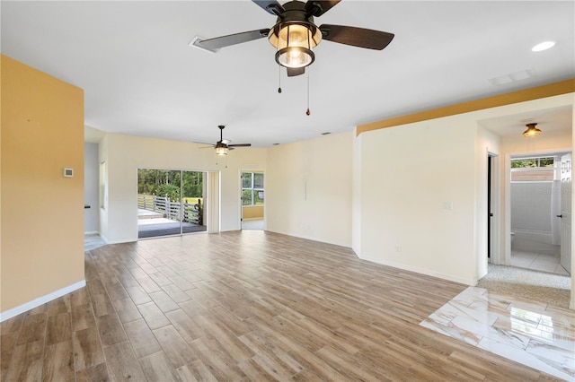 unfurnished living room with light hardwood / wood-style floors and ceiling fan