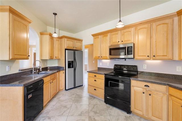 kitchen with light brown cabinetry, sink, hanging light fixtures, and black appliances