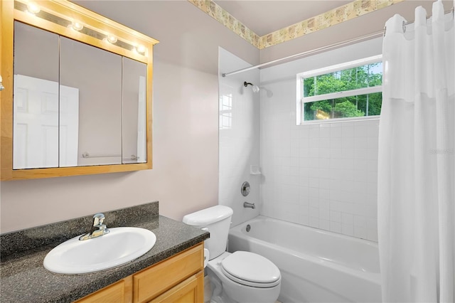 full bathroom featuring shower / bath combination with curtain, vanity, and toilet