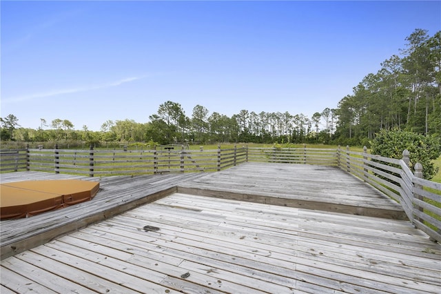 deck with a covered hot tub