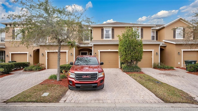 221 Aston Grande Dr, Daytona Beach, FL 32124 - townhome / multi-family property with a garage
