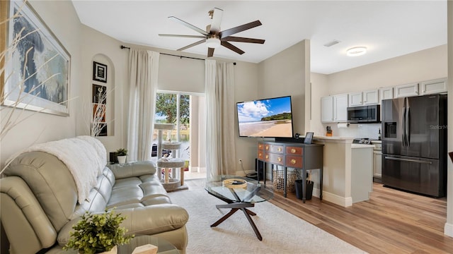 221 Aston Grande Dr, Daytona Beach, FL 32124 - living room featuring ceiling fan and light wood-type flooring